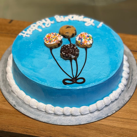 top view of a balloon-themed ice cream cake showcasing its playful birthday party decorations.