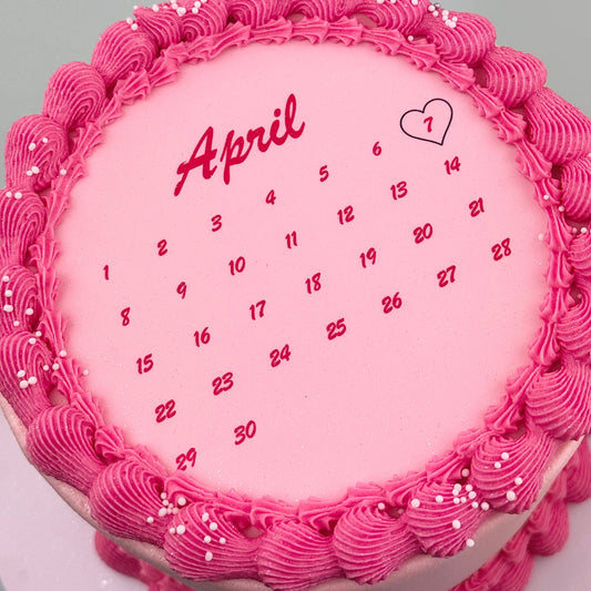 Close-up of the calendar layout and highlighted special date on a personalised celebration cake handcrafted in Adelaide.