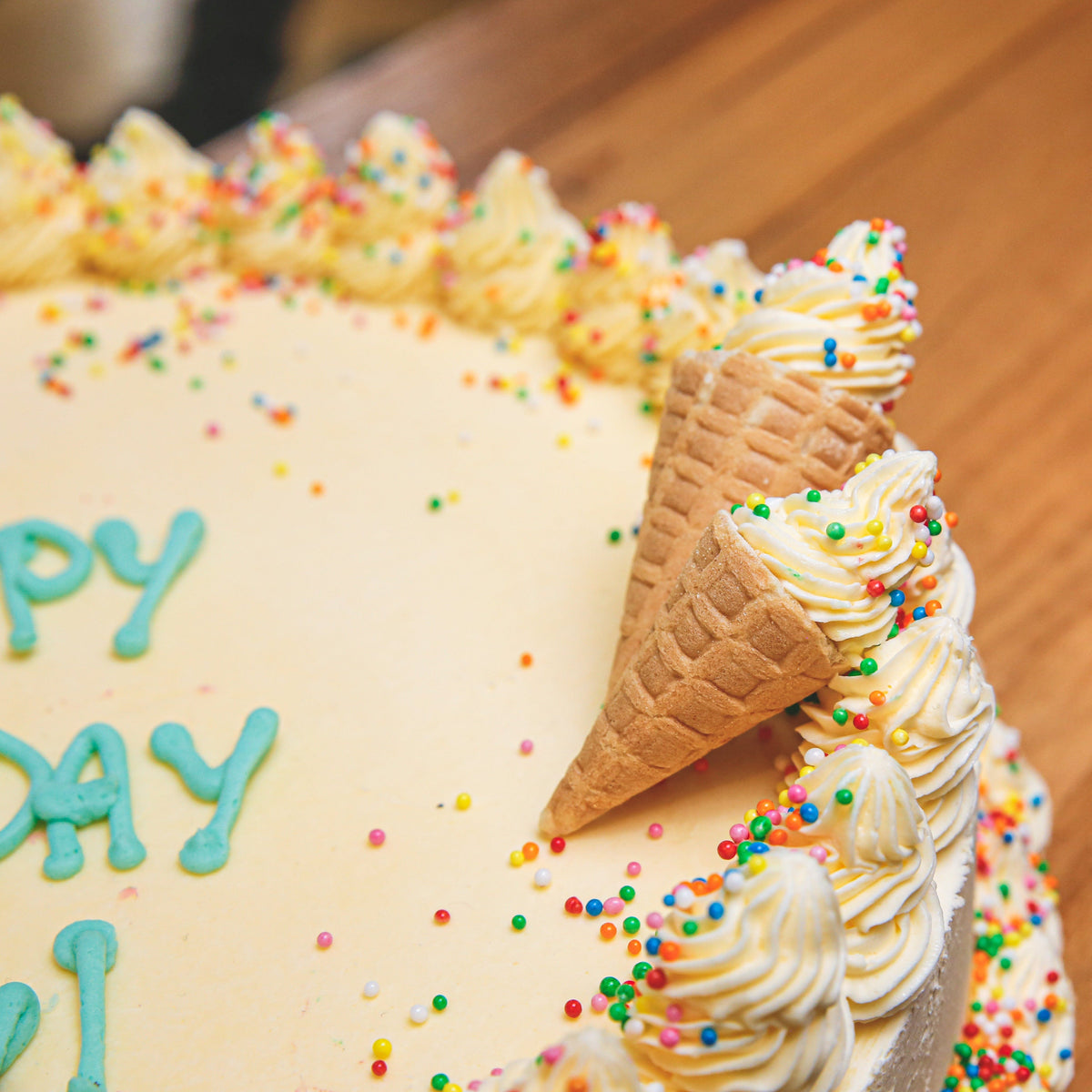 close up of a handcrafted celebration ice cream cake highlighting its decorative finish for a special occasion.