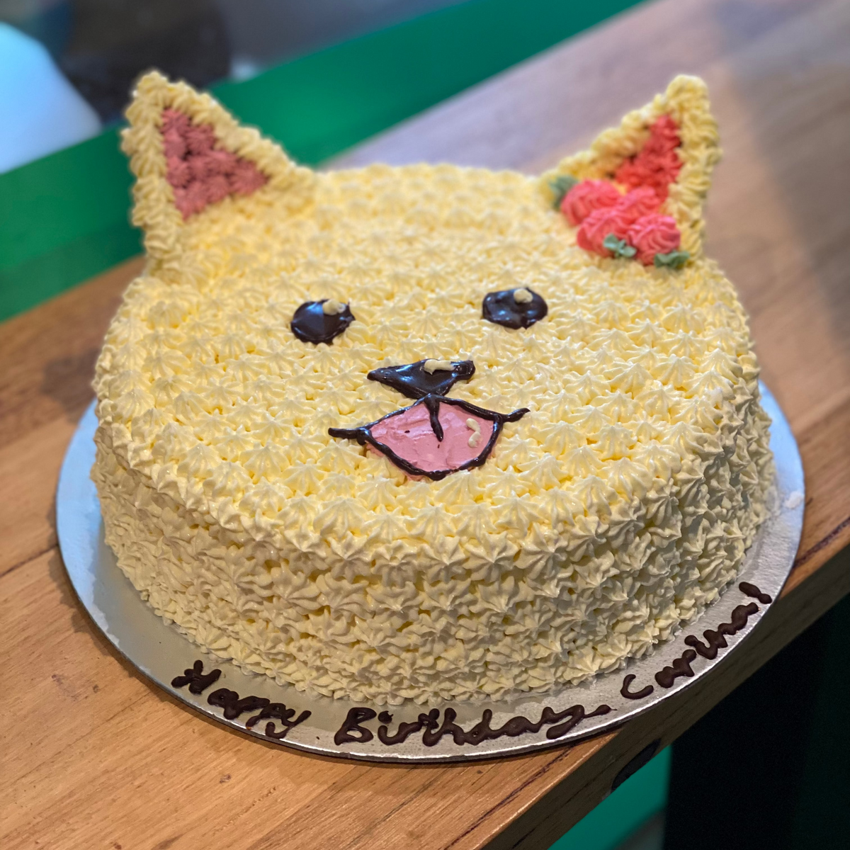 front view of a handcrafted dog-themed ice cream cake made using Ben & Jerry's ice cream in Adelaide, ideal for a puppy-themed birthday parties