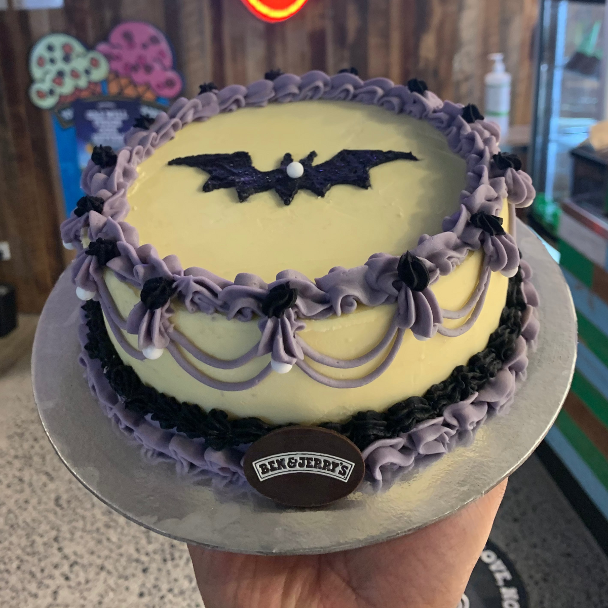 Front view of a vintage Halloween birthday cake made with Ben & Jerry's ice cream in Adelaide, showcasing its purple-and-black gothic styling.