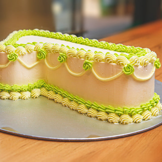 side view of a number one birthday cake showcasing its distinctive numeral-shaped design for a first birthday party.