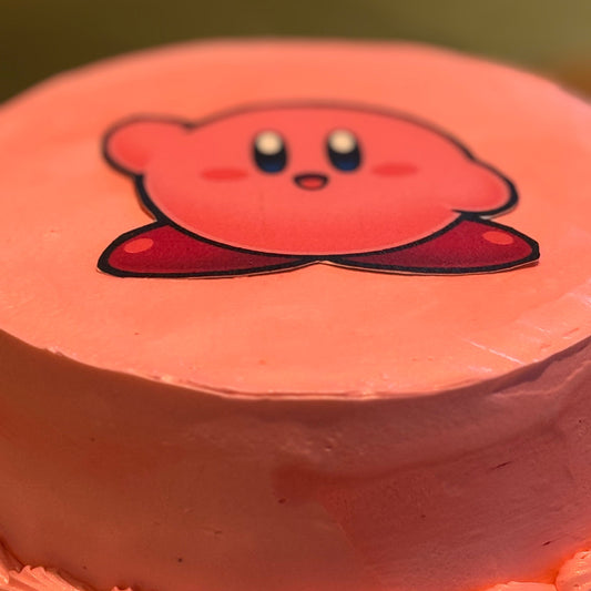 close up of a Kirby-themed birthday cake made with Ben & Jerry's ice cream in Adelaide, showcasing its cheerful pink character styling.