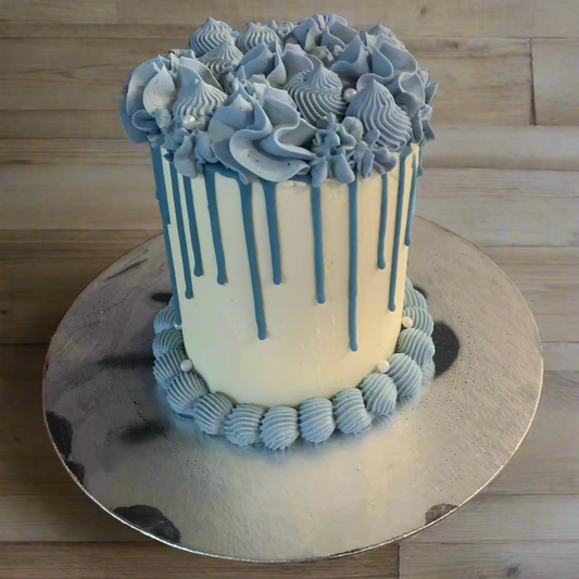 Front view of a tall blue pearl birthday cake made with Ben & Jerry's ice cream in Adelaide, showcasing its classic vintage-inspired piping.