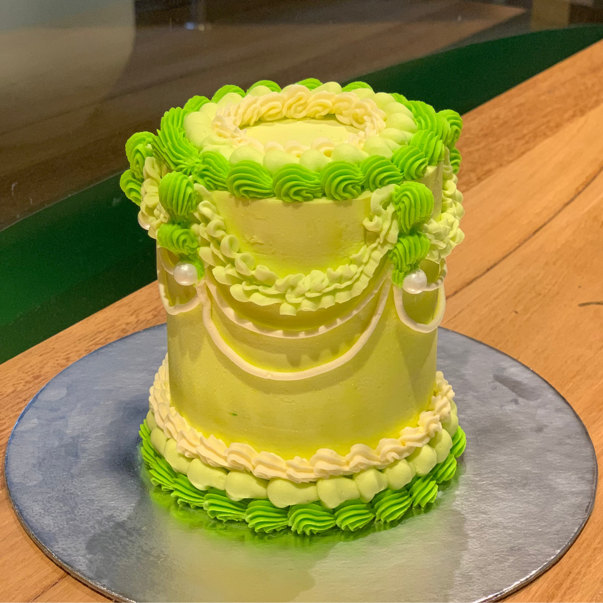 front view of a handcrafted tall vintage ice cream cake made using Ben & Jerry's ice cream in Adelaide, highlighting its elongated silhouette.