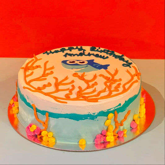 Full view of a Baby Shark birthday cake handcrafted in Adelaide using Ben & Jerry's ice cream, featuring a playful underwater-themed design.