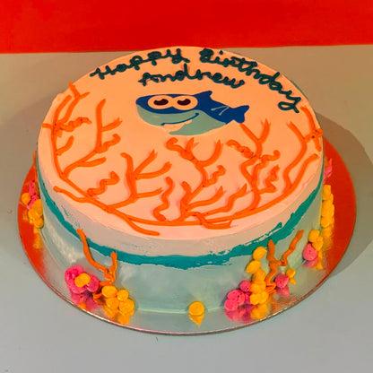 top view 1of the Baby Shark-inspired decorative details on a birthday cake handcrafted in Adelaide using Ben & Jerry's ice cream.