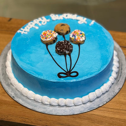 top view of a balloon-themed ice cream cake showcasing its playful birthday party decorations.