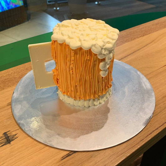 Full view of a beer pint-inspired birthday cake handcrafted in Adelaide using Ben & Jerry's ice cream, featuring a playful novelty design.