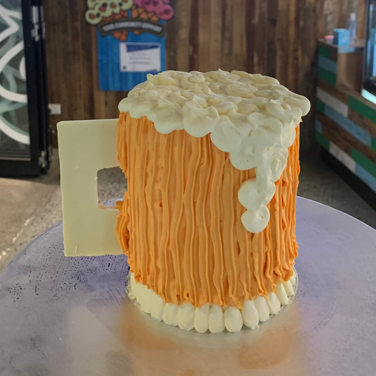 Front view of a beer pint-themed birthday cake made with Ben & Jerry's ice cream in Adelaide, showcasing its distinctive pint-inspired appearance.