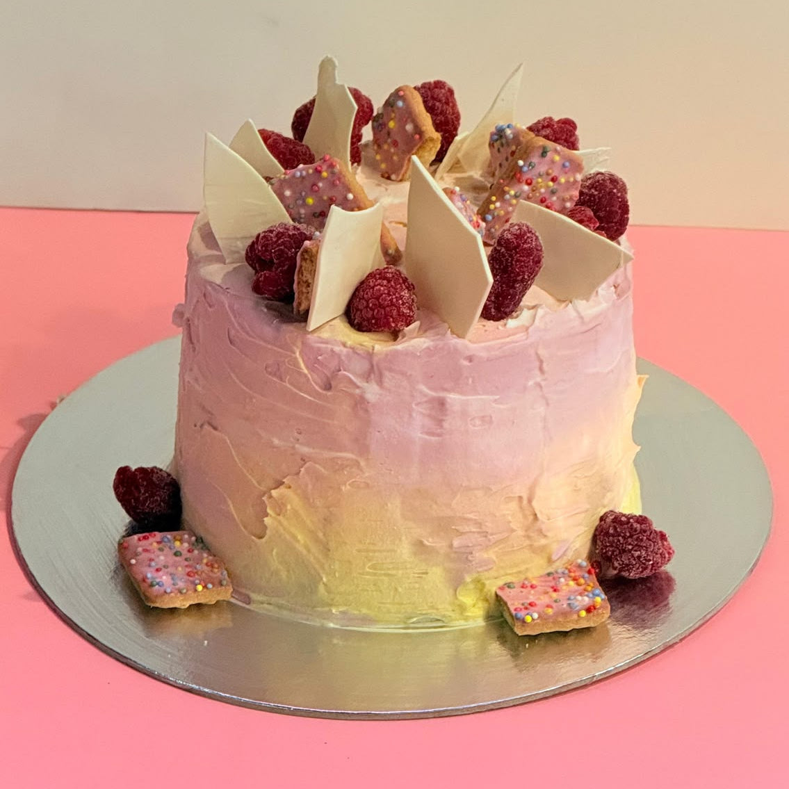front view of the Berry Fairy Pastel Picnic Ice Cream Cake handcrafted with Ben & Jerry’s ice cream and personalised whimsical details.