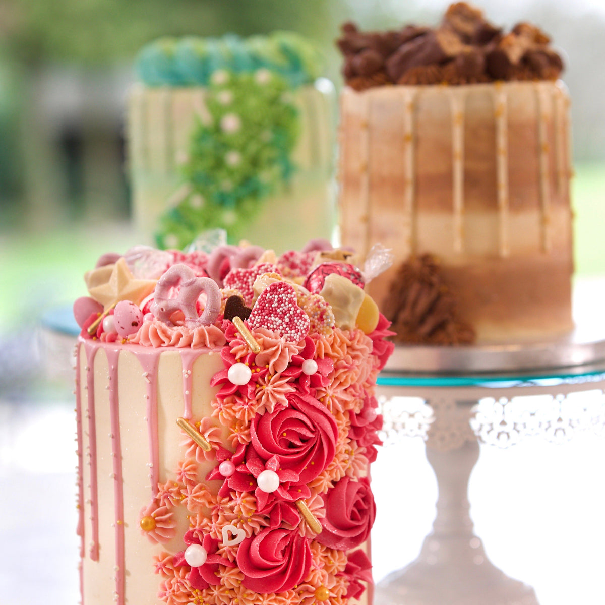 Front view of a brown cascading cake in Adelaide, showcasing its textured decoration and sophisticated neutral styling.