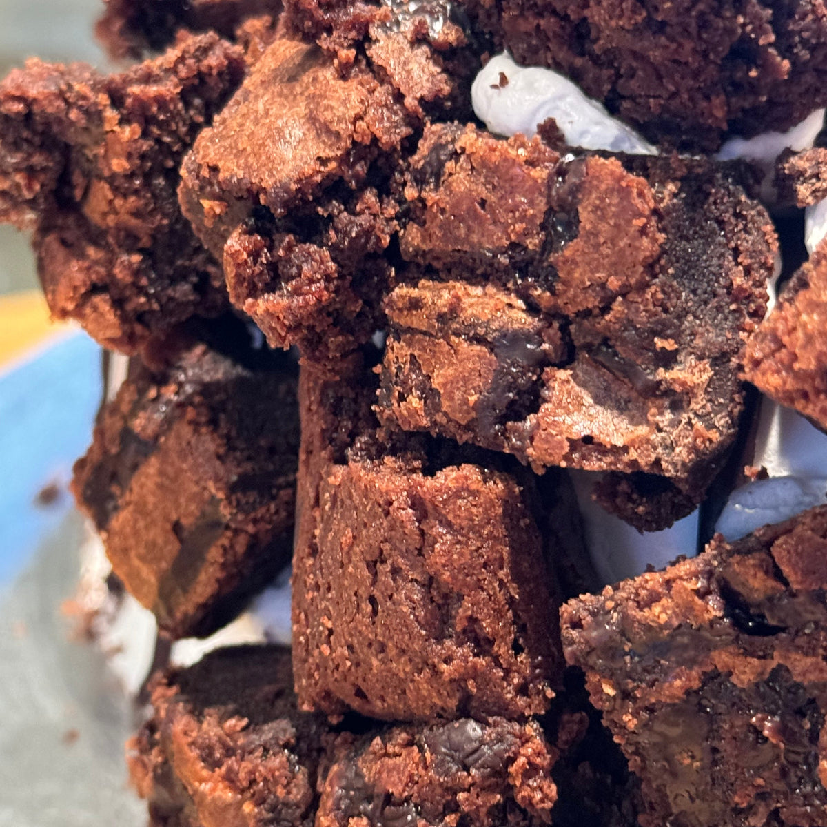 close up of a decadent brownie lovers cake made with Ben & Jerry's ice cream in Adelaide, showcasing its indulgent brownie toppings.
