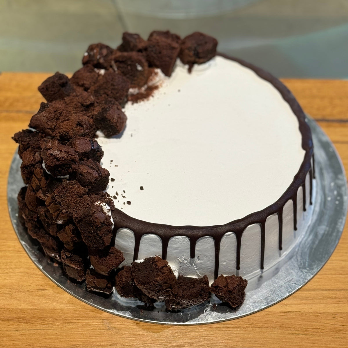 top view of a handcrafted brownie ice cream cake in Adelaide made using Ben & Jerry's ice cream, highlighting its rich brownie decorations.