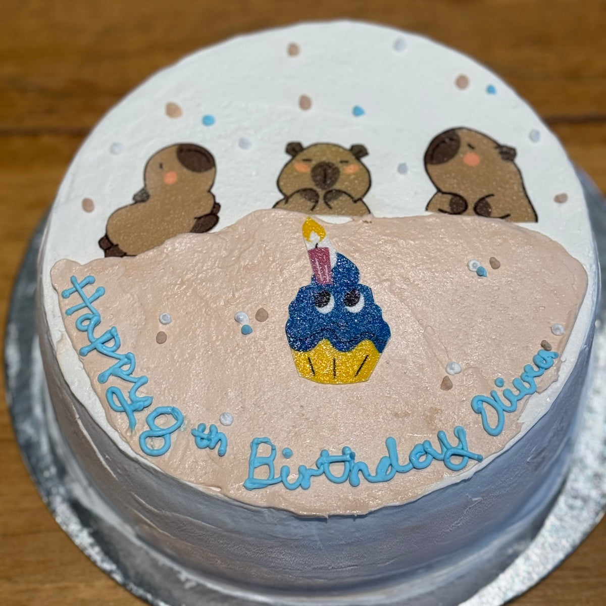top view of a capybara birthday cake made with Ben & Jerry's ice cream in Adelaide, showcasing its adorable animal-inspired design.