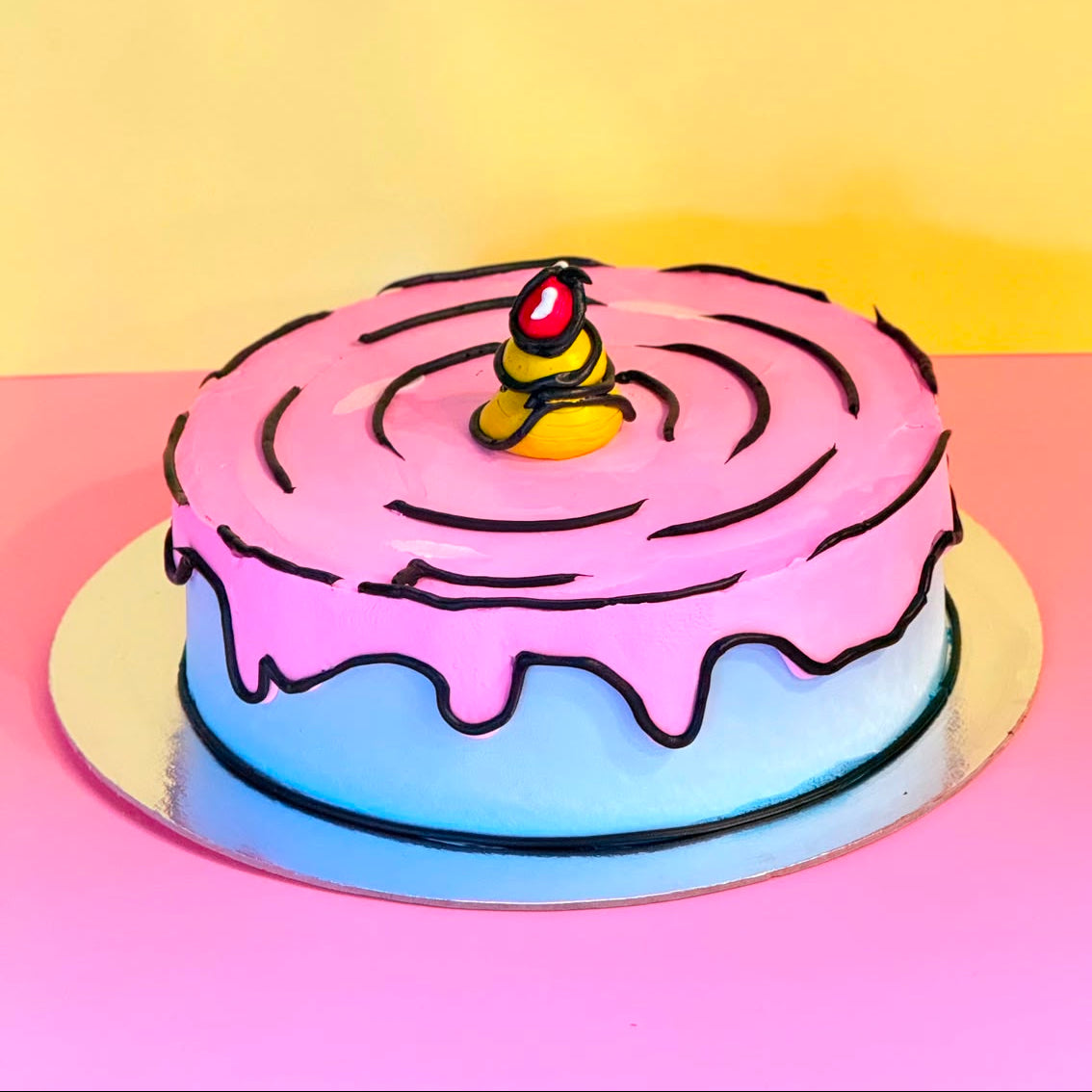 front view of a handcrafted cartoon-style ice cream cake made using Ben & Jerry's ice cream in Adelaide, highlighting its illustrated decorative finish.