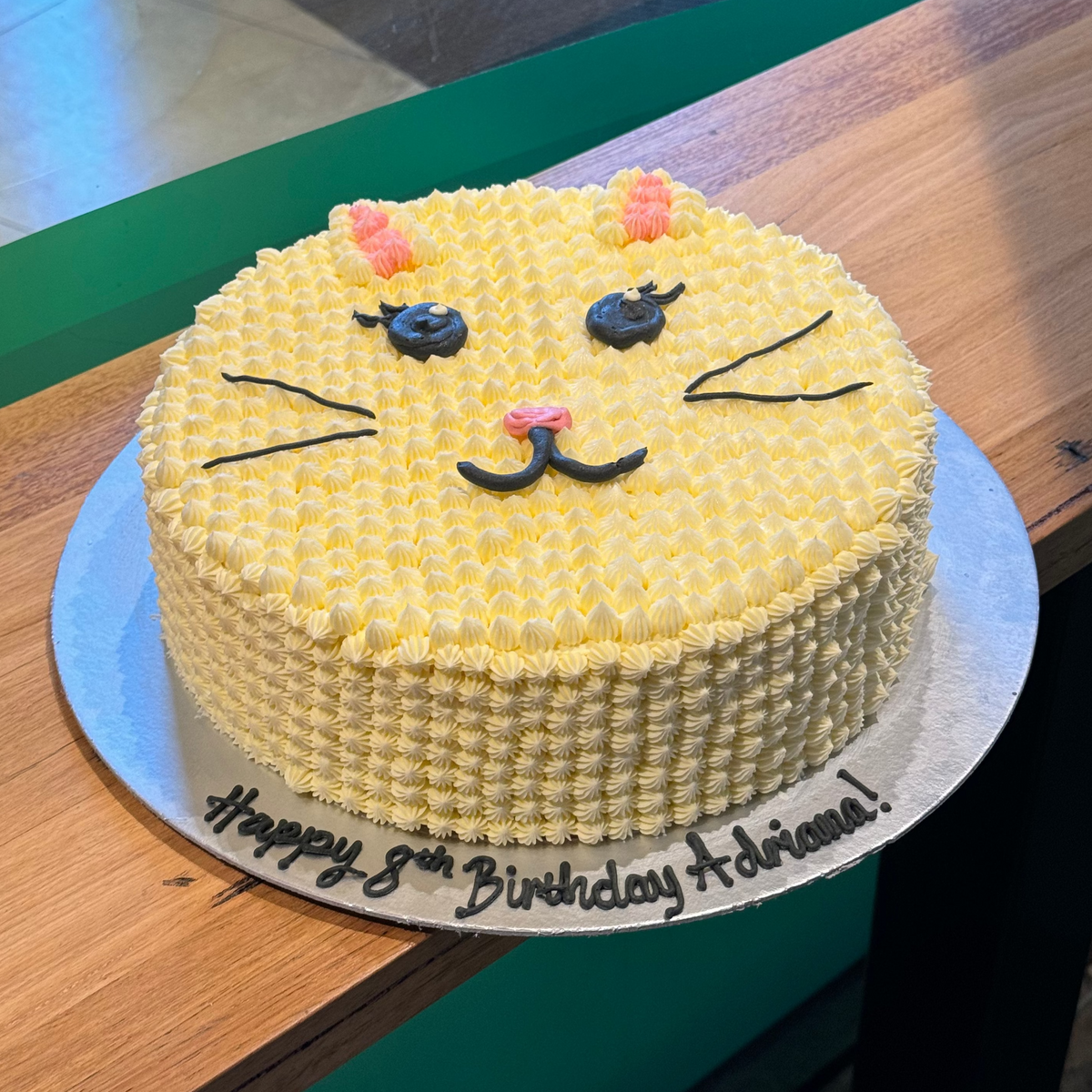 Full view of a cute cat-themed birthday cake handcrafted in Adelaide using Ben & Jerry's ice cream, featuring a playful feline-inspired design.