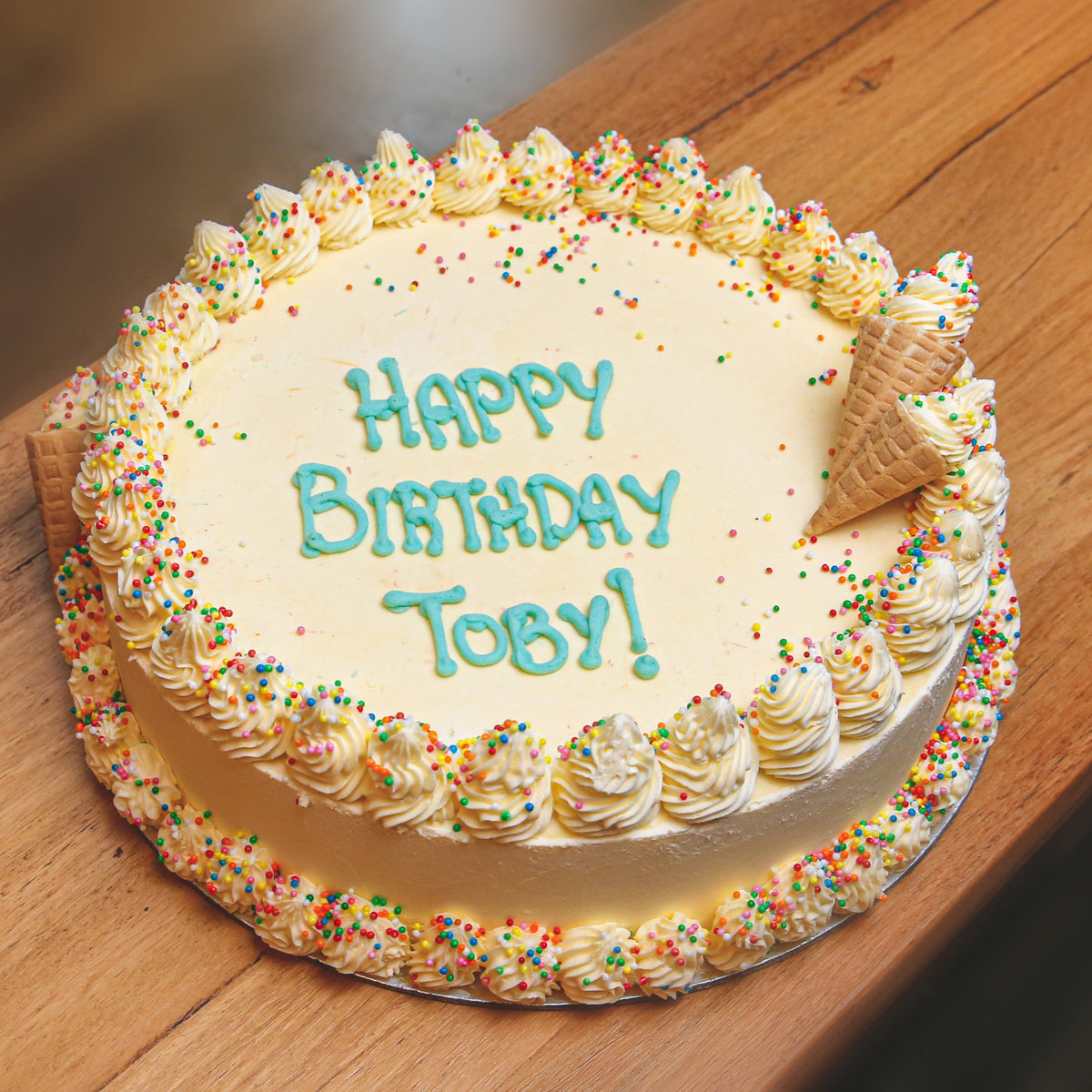 Full view of a handcrafted Celebrations ice cream cake designed for birthdays and special occasions.