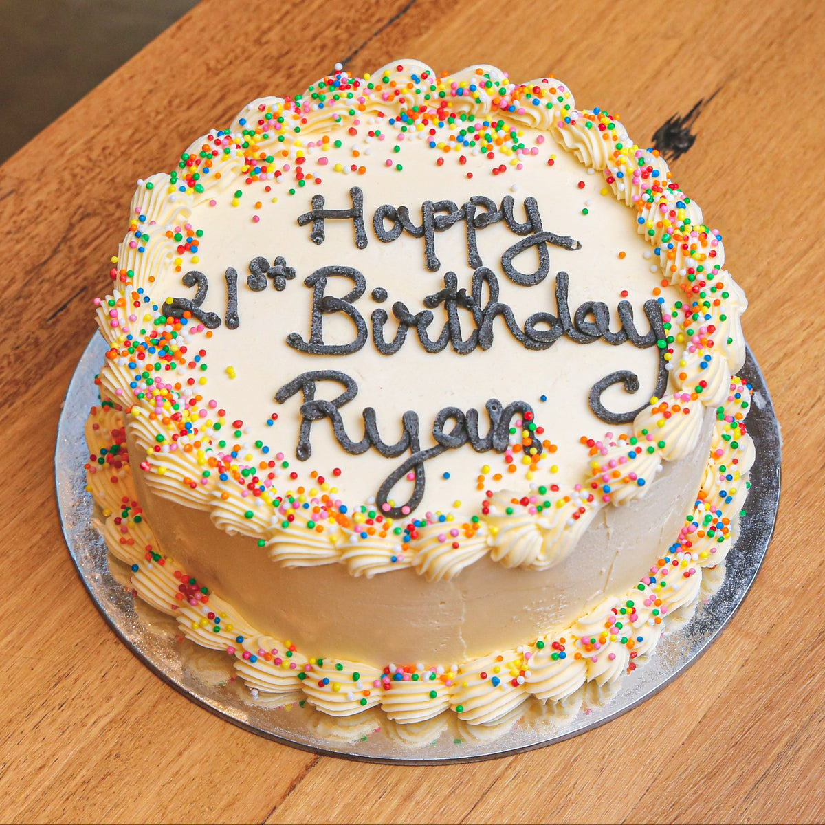 top view of Celebrations Cake Design 3, a handcrafted birthday ice cream cake featuring festive decorations without ice cream cones.
