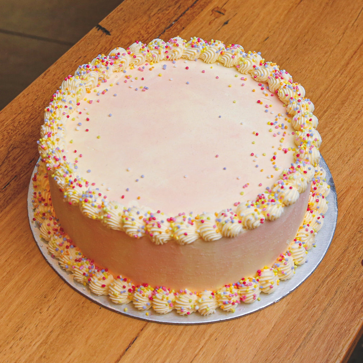 Full view of Celebrations Cake Design #4, a festive birthday cake handcrafted in Adelaide using Ben & Jerry's ice cream.