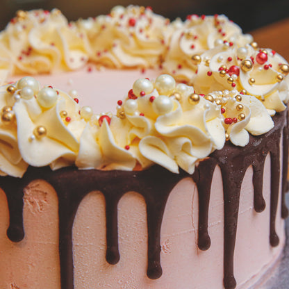 close up of a chocolate ganache ice cream cake decorated with assorted sweet treats, handcrafted for birthday celebrations in Adelaide.