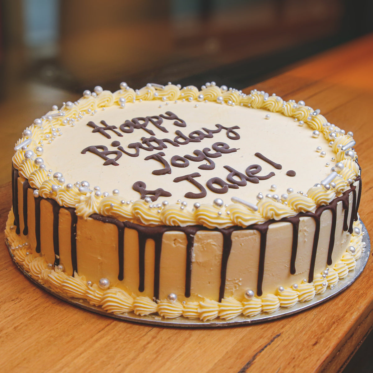 Front view of Celebrations Cake Design 2 showcasing its decorative birthday cake presentation.