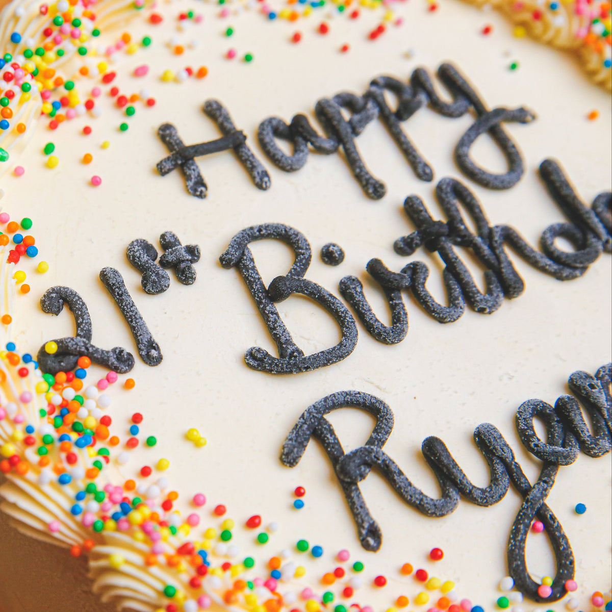 Close-up view of the decorative details on Celebrations Cake Design 3, featuring a festive birthday design without cone decorations.