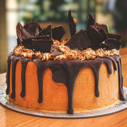 Front view of a chocolate shard ice cream cake showcasing its chocolate-inspired design and striking shard decorations.