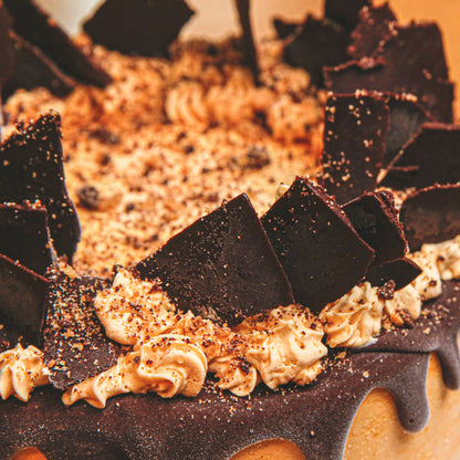 close up of a handcrafted chocolate shard birthday cake highlighting its decorative chocolate detailing and celebration-ready finish.