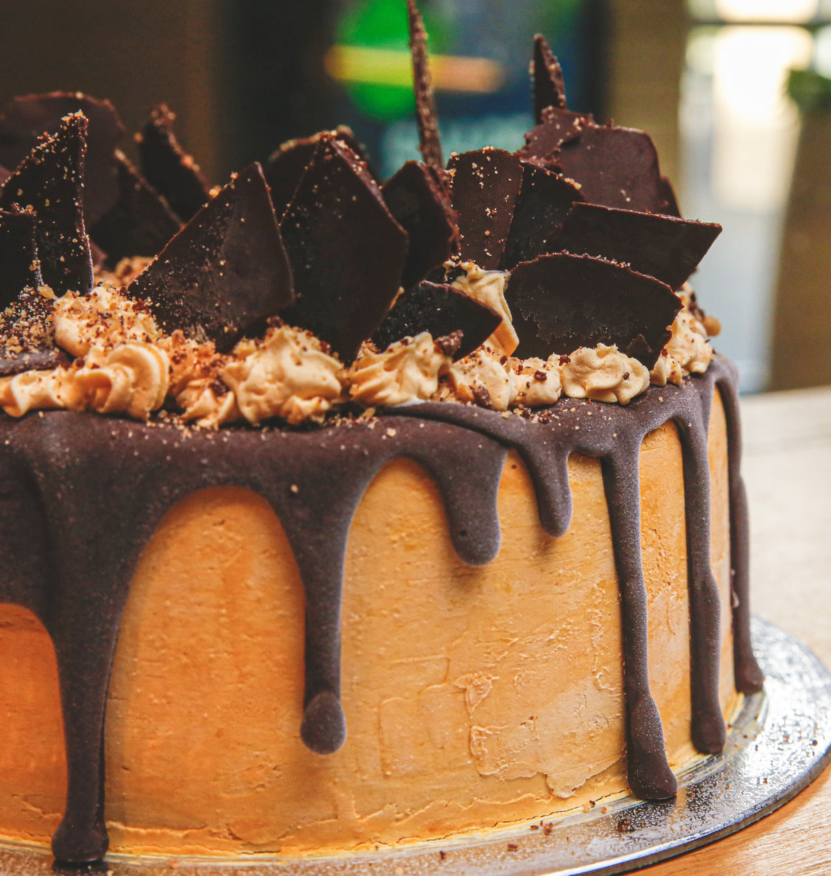 Close-up view of the decorative chocolate shards on a handcrafted birthday ice cream cake for chocolate lovers.