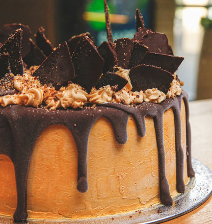 Close-up view of the decorative chocolate shards on a handcrafted birthday ice cream cake for chocolate lovers.