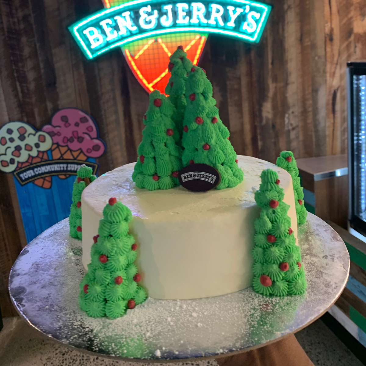 Front view of a Christmas tree cake made with Ben & Jerry's ice cream in Adelaide, showcasing its cheerful holiday-inspired design.