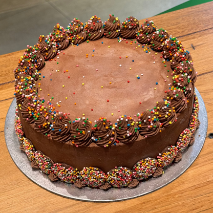 Full view of a Classic Chocolate Celebrations ice cream cake featuring chocolate-inspired decorations for birthdays and special occasions.