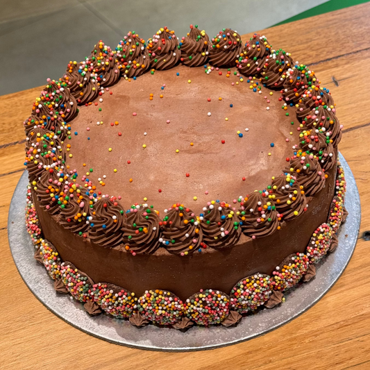 Full view of a Classic Chocolate Celebrations ice cream cake featuring chocolate-inspired decorations for birthdays and special occasions.