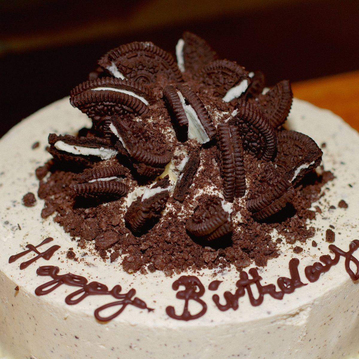 Close-up of the cookie-inspired decorative details on a birthday cake handcrafted in Adelaide using Ben & Jerry's ice cream.