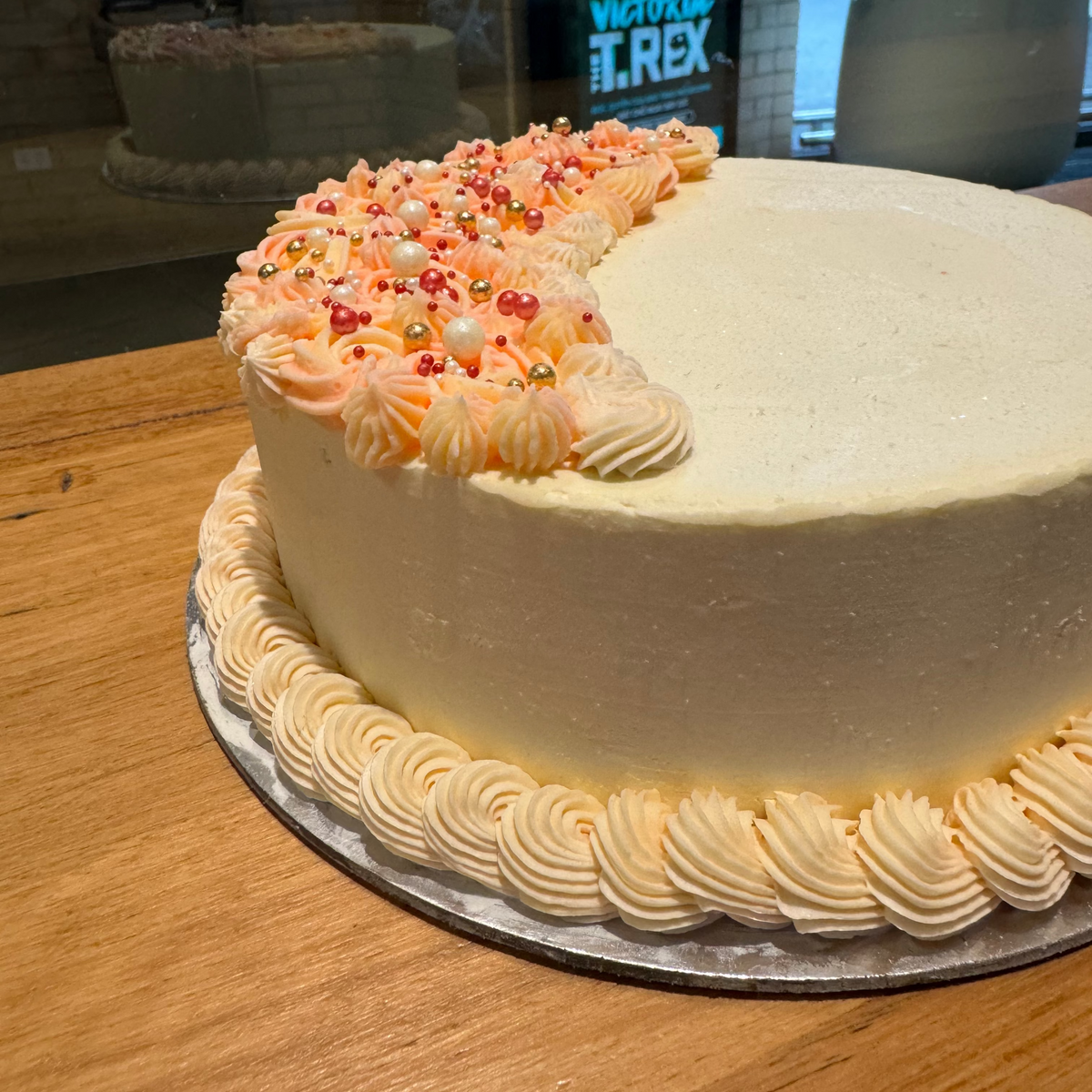Side view of a handcrafted crescent moon cake made using Ben & Jerry's ice cream in Adelaide, highlighting its unique moon-inspired shape.