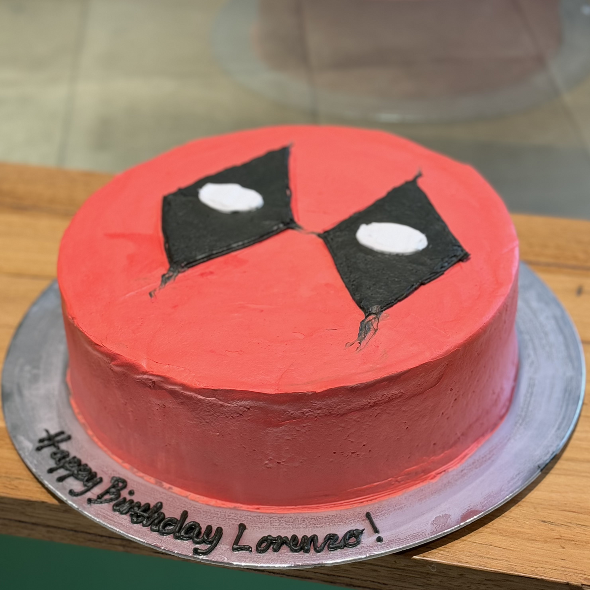 side view of a Deadpool birthday cake made with Ben & Jerry's ice cream in Adelaide, showcasing its recognisable superhero-inspired theme.