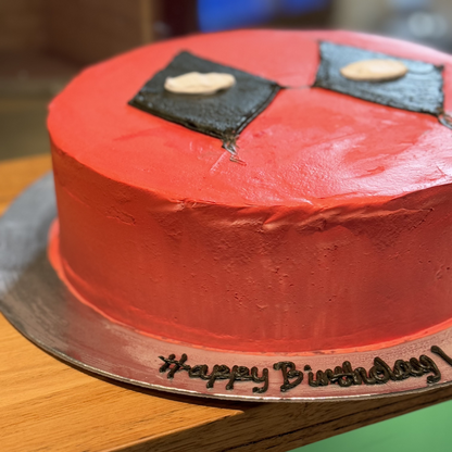 Close-up of the Deadpool-inspired decorative details on a birthday cake handcrafted in Adelaide using Ben & Jerry's ice cream.