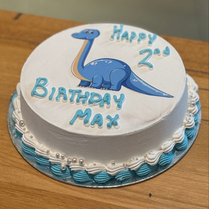 Full view of a dinosaur-themed birthday cake handcrafted in Adelaide using Ben & Jerry's ice cream, featuring playful prehistoric-inspired decorations.