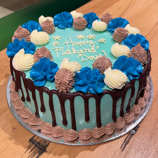 Full view of a blue and white Father's Day cake handcrafted in Adelaide using Ben & Jerry's ice cream, designed as a special celebration treat for Dad