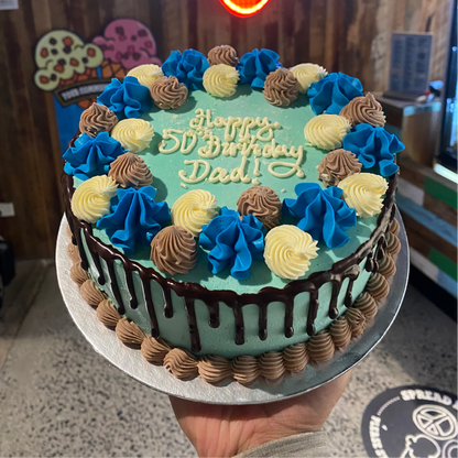 top view of a Father's Day cake made with Ben & Jerry's ice cream in Adelaide, showcasing its classic blue and white decorative presentation.