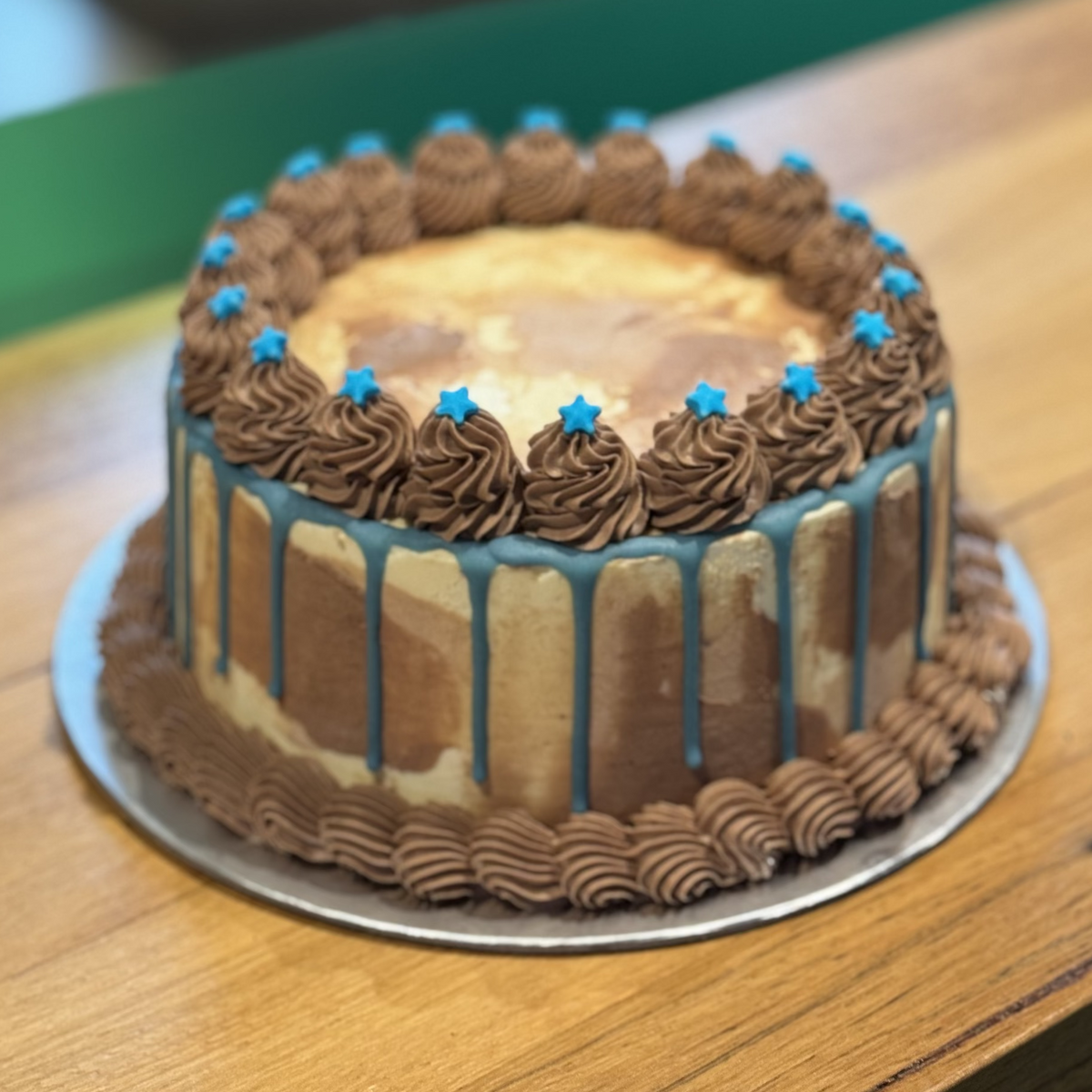 front view of a handcrafted blue and white Father's Day ice cream cake made using Ben & Jerry's ice cream in Adelaide, perfect for family celebrations.