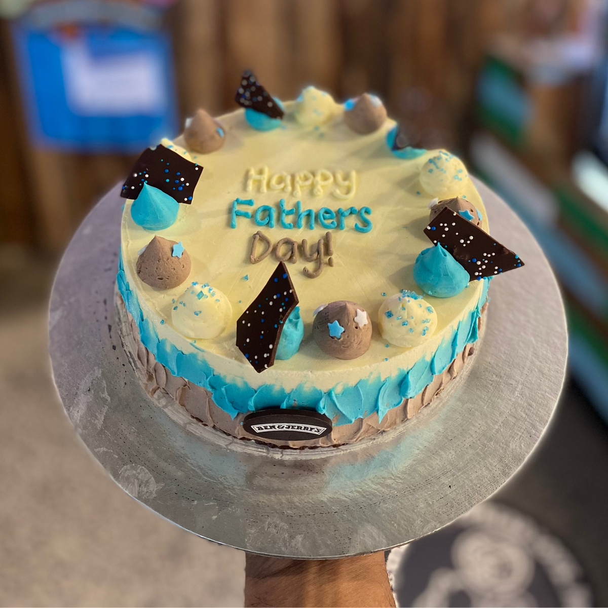 top view of a Father's Day cake made with Ben & Jerry's ice cream in Adelaide, showcasing its classic blue and white decorative styling.