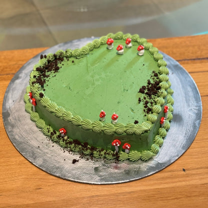 Full view of a forest mushroom Oreo heart cake handcrafted in Adelaide using Ben & Jerry's ice cream, featuring whimsical woodland decorations.