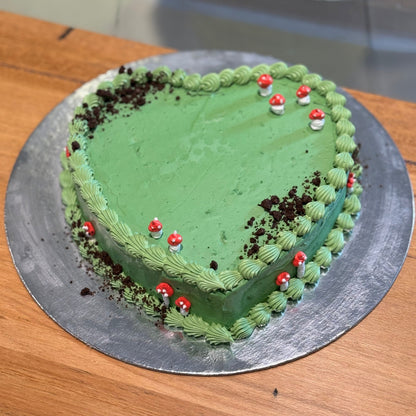 top view of a handcrafted forest mushroom heart cake in Adelaide made using Ben & Jerry's ice cream, highlighting its woodland-themed styling.