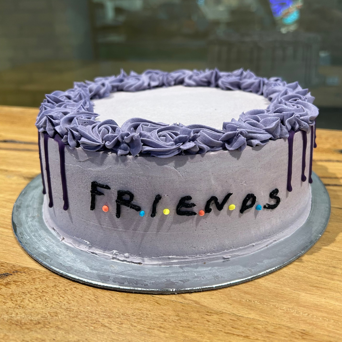 front view of a handcrafted Friends TV series ice cream cake made using Ben & Jerry's ice cream in Adelaide, highlighting its sitcom-themed presentation.