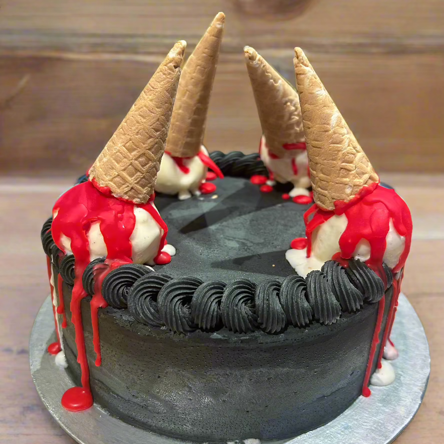 Front view of a Halloween birthday cake made with Ben & Jerry's ice cream in Adelaide, showcasing its dramatic blood-effect cone decorations.