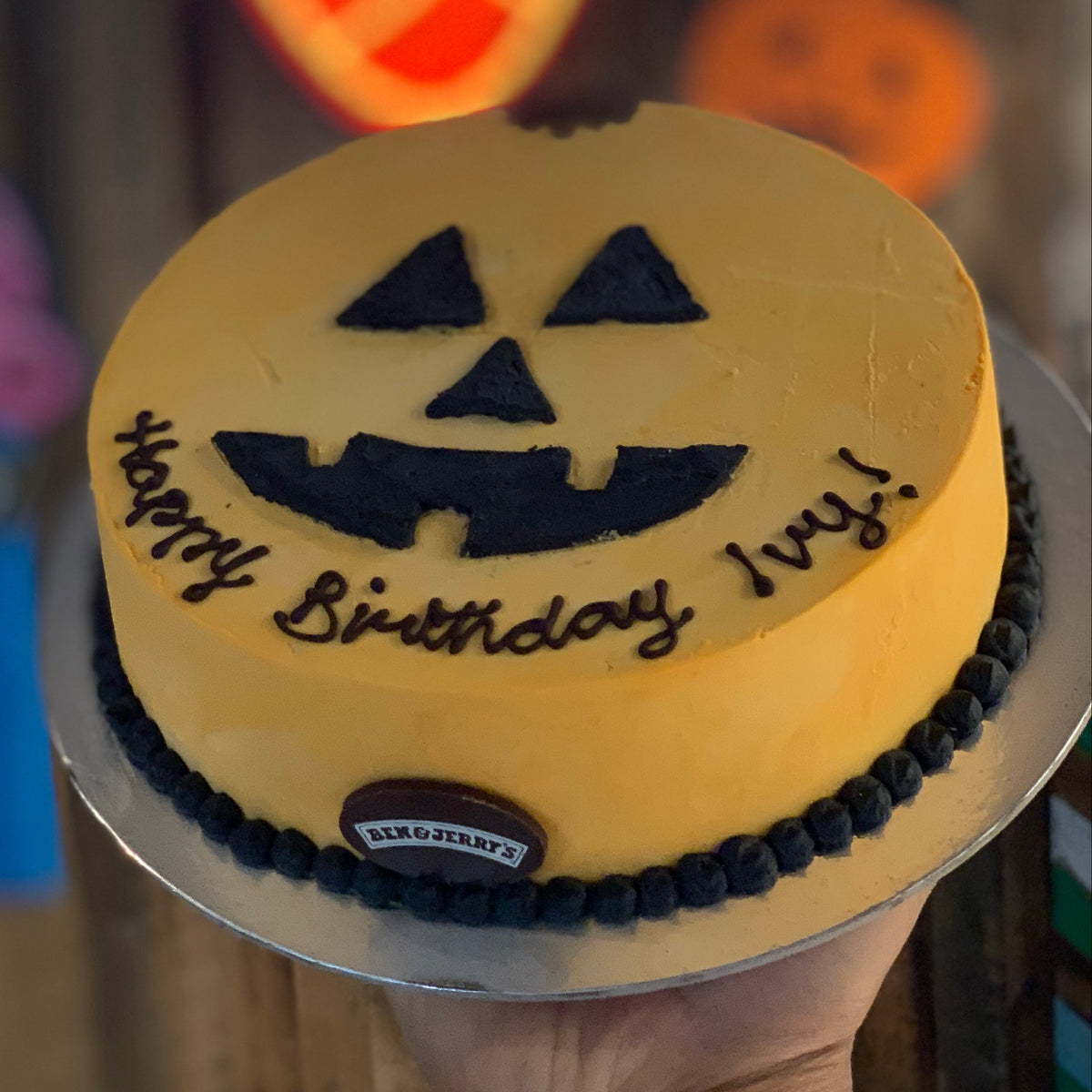 top view of a handcrafted Halloween pumpkin ice cream cake made using Ben & Jerry's ice cream in Adelaide, highlighting its spooky character-inspired appearance.