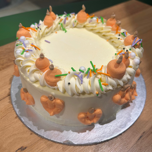Full view of a Halloween pumpkin-themed cake handcrafted in Adelaide using Ben & Jerry's ice cream, featuring festive pumpkin-inspired decorations.