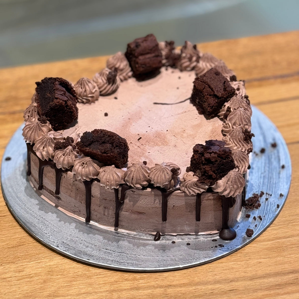 Full view of a heart-shaped chocolate fudge brownie cake handcrafted in Adelaide using Ben & Jerry's ice cream, featuring an indulgent chocolate design.